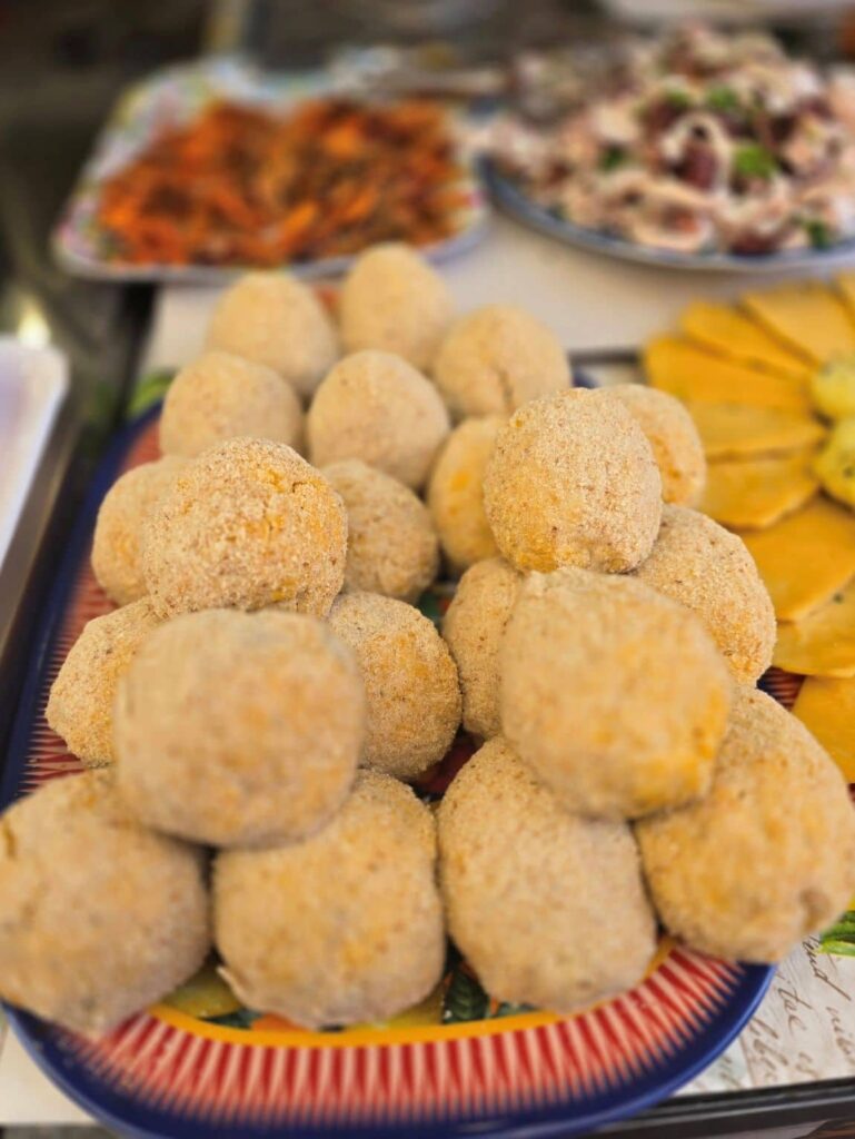 Arancine (stuffed rice balls) are a popular street food in Palermo