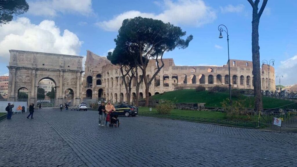 The Colosseum and Arch of Constantine in Rome. Touring these ancient sites is among the best things to do in Rome.