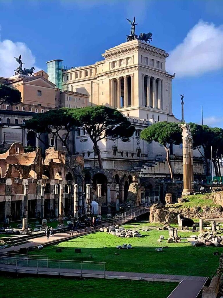 The Altare della Patria monument behind the ruins of the Roman Forum in Rome. Visting these sites is among the best things to do in Rome. 