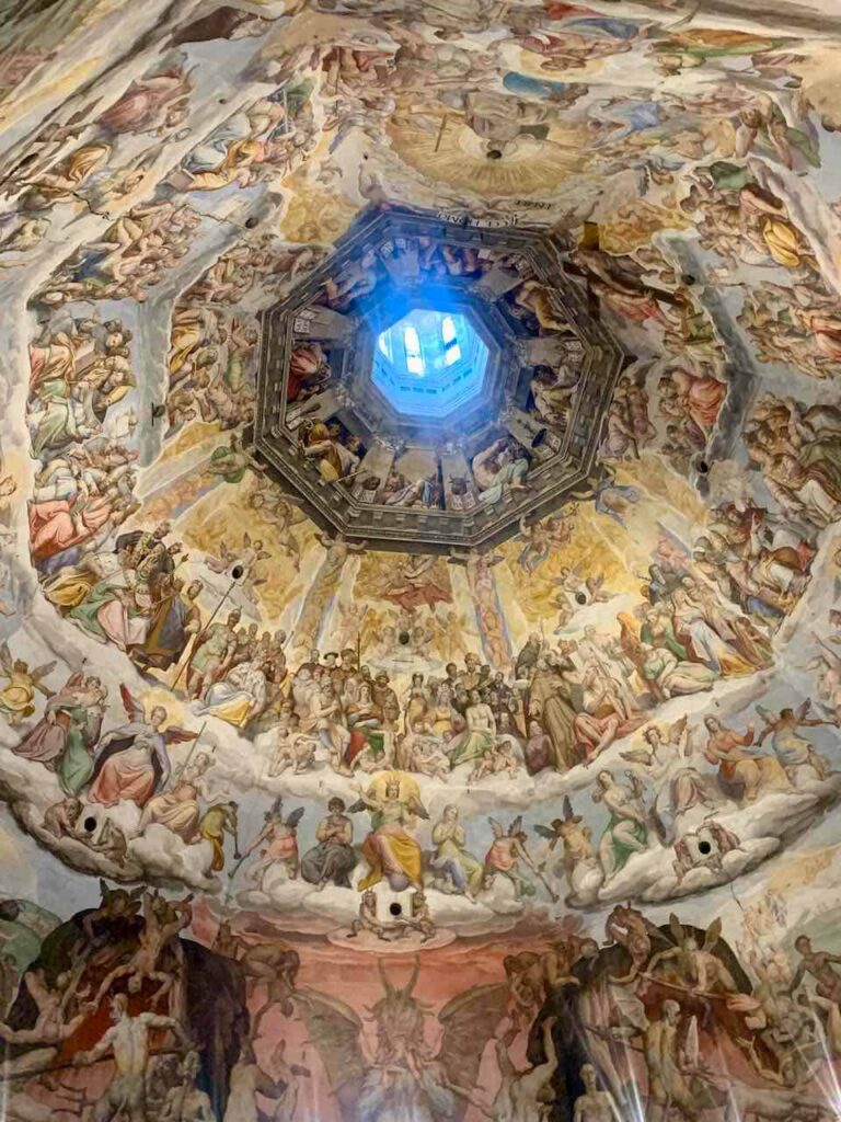The Last Judgment fresco by Vasari and Zuccari inside the dome of the Cathedral of Florence. It is a must-see on a Rome to Florence day trip