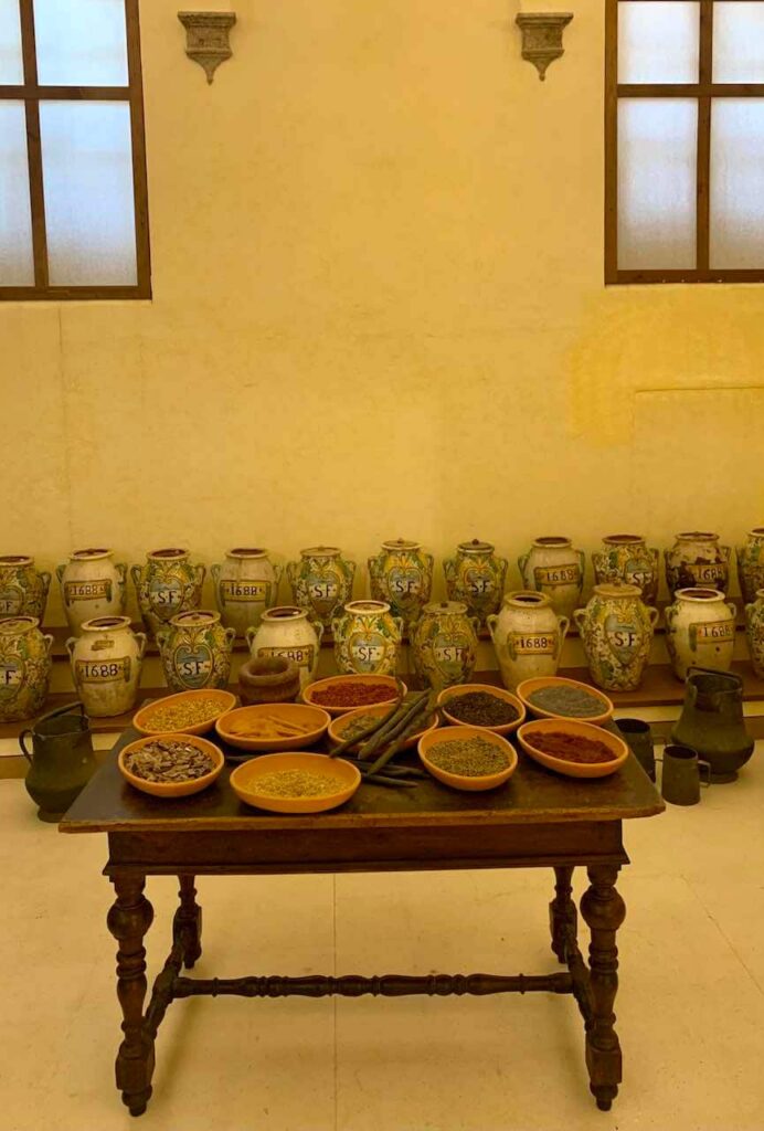 Ancient pharmacy pots of the Pharmacy of Santa Fina in San Gimignano, Tuscany, Italy 