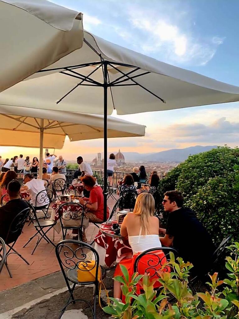 People enjoy drinks on the terrace of Vip's Bar