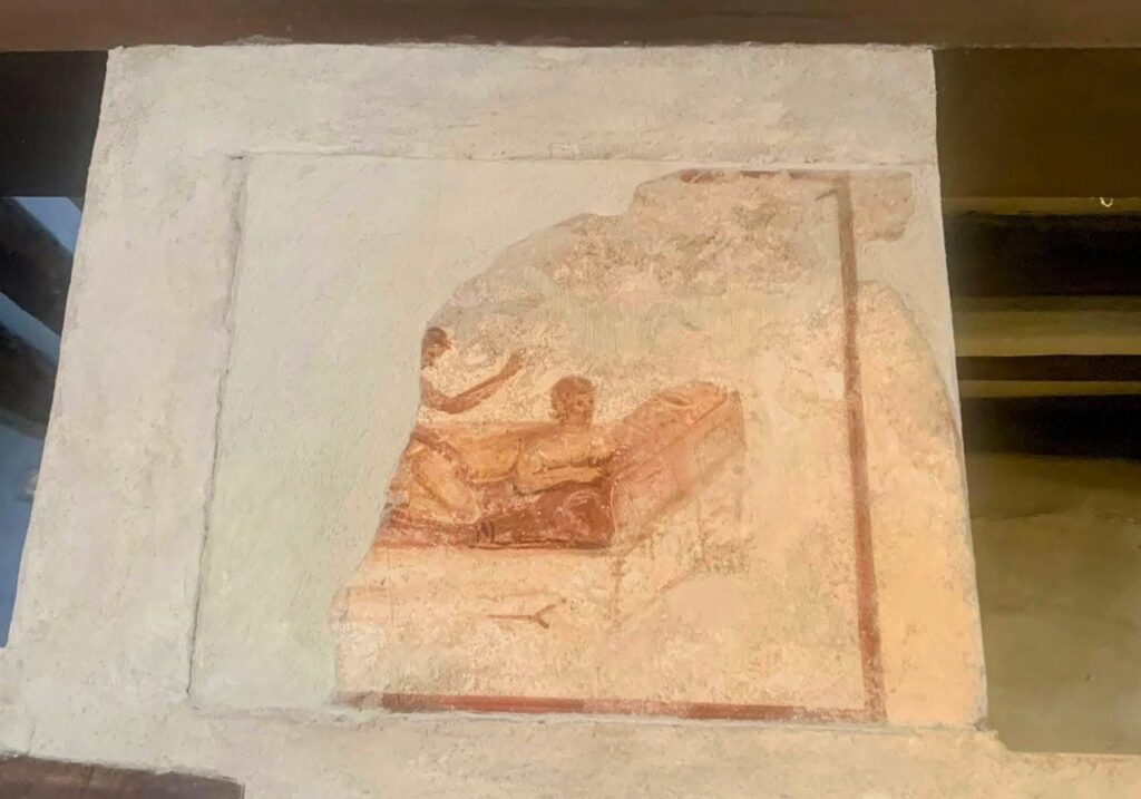 Well-preserved erotic fresco on the wall of the Lupanar in Pompeii