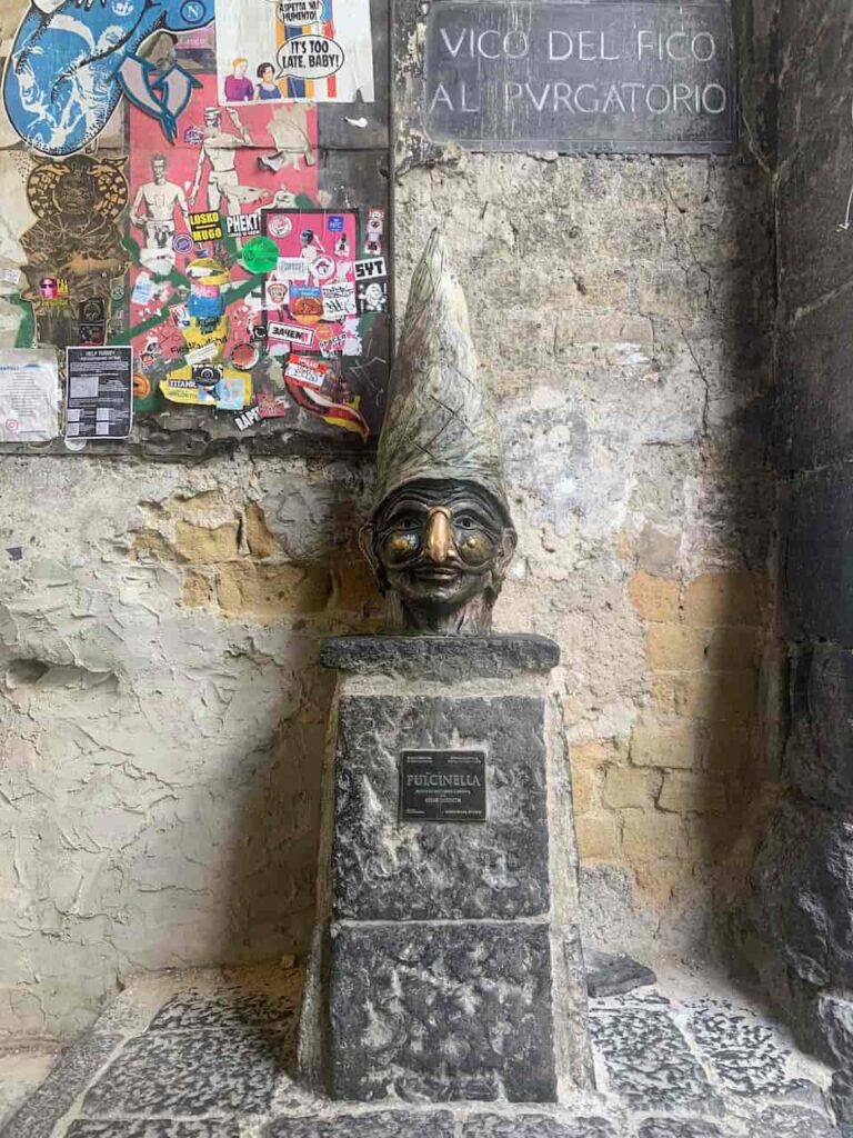 A Day in Naples is All It Takes to Get Obsessed With Italy's Wildest City — Follow This Itinerary The statue of Pulcinella, a famous bronze sculpture located in the historic center of Naples, Italy