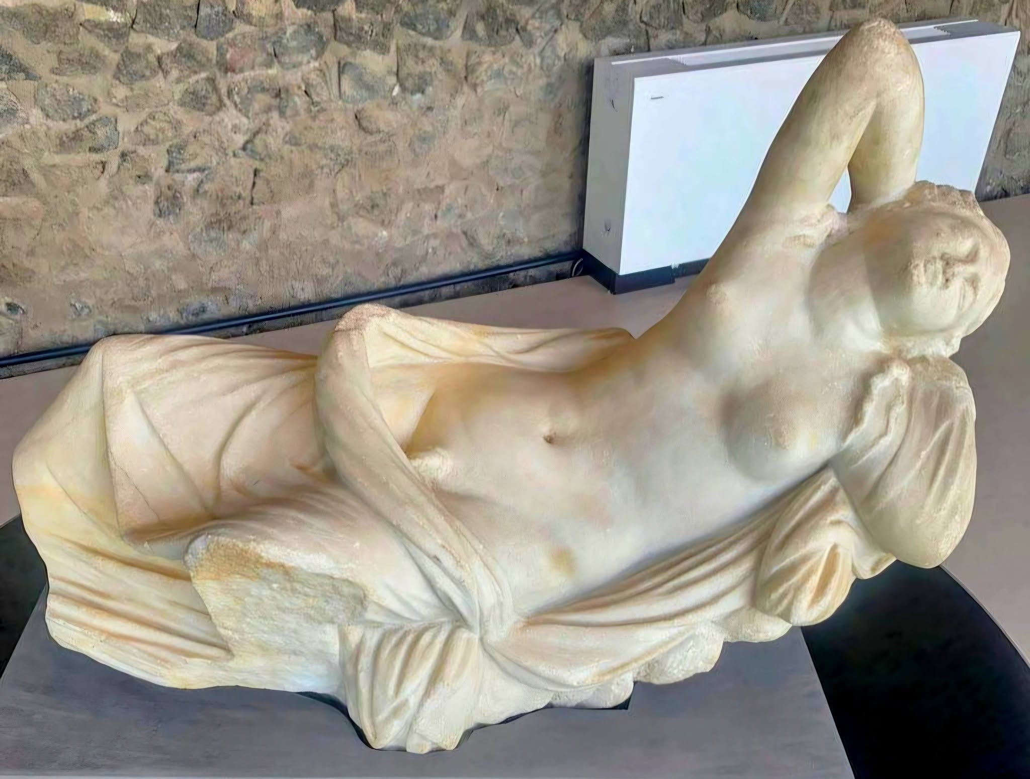 Sleeping Hermaphrodite, a marble statue - touring Pompeii