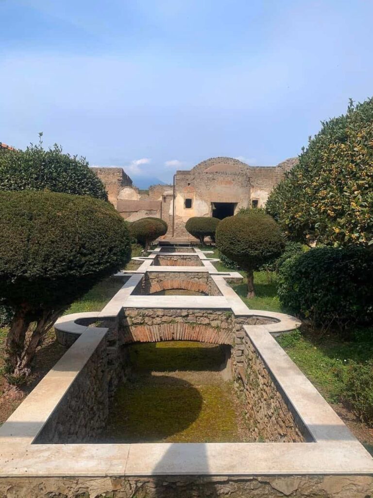Courtyard of the House of Julia Felix in Pompeii with ancient Roman columns and garden