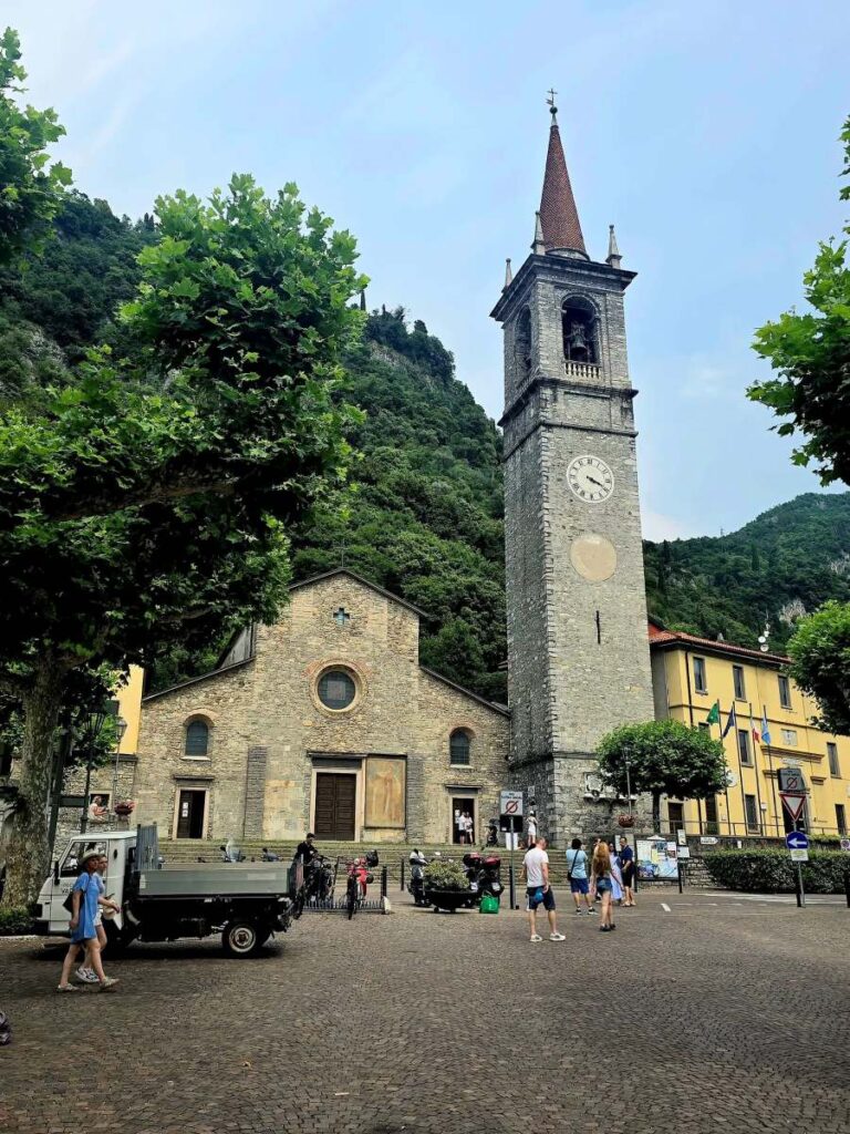 The historic Piazza San Giorgio with the Church of San Giorgio and its prominent bell tower - Varenna lake Como 