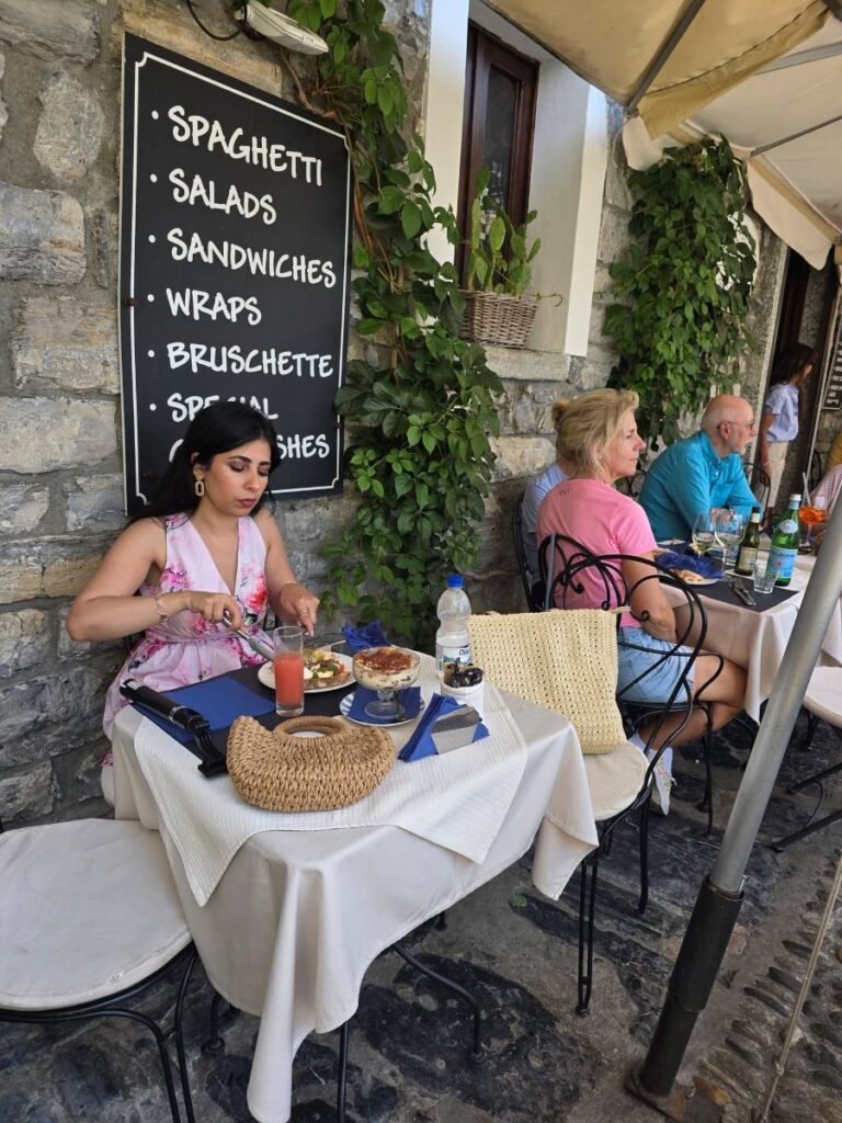 A lady dining in  Varenna Caffè Bistrot located in Varenna, Italy