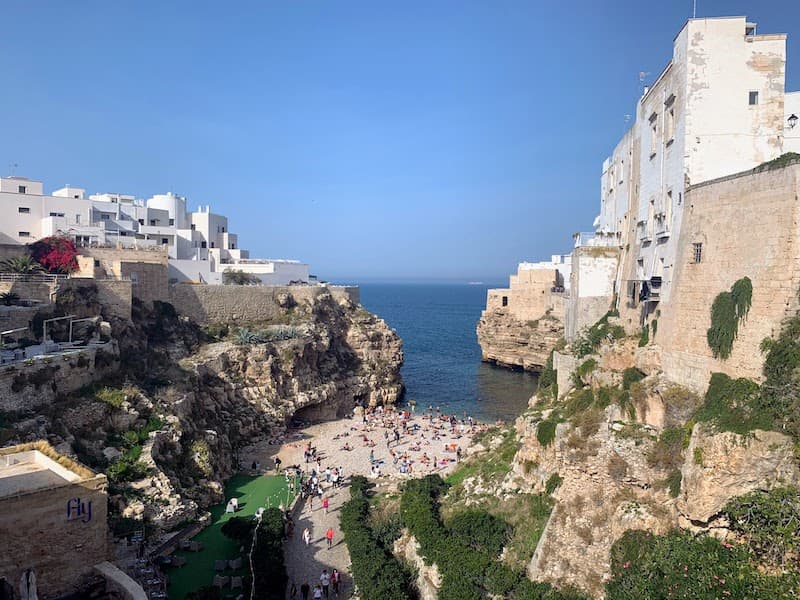 I Drove All Over Puglia, Italy — Here Are 6 Road Trip Itineraries That Actually Work Lama Monachile pebble beach between limestone cliffs in Polignano a Mare, Puglia