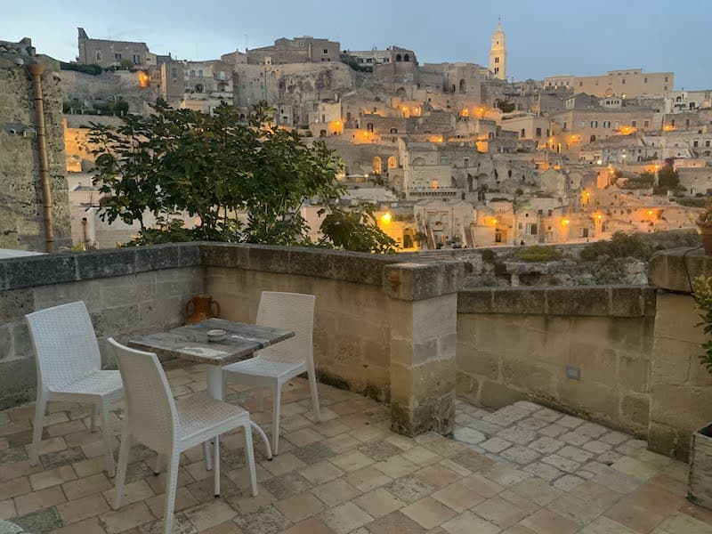 I Drove All Over Puglia, Italy — Here Are 6 Road Trip Itineraries That Actually Work Terrace view from a cave hotel overlooking the ancient Sassi di Matera in Basilicata, Italy.