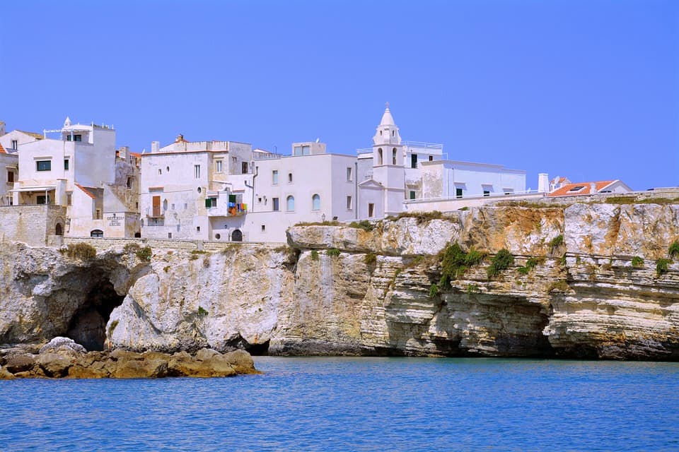I Drove All Over Puglia, Italy — Here Are 6 Road Trip Itineraries That Actually Work Vieste perched on white limestone cliffs above the Adriatic Sea, Gargano, Puglia