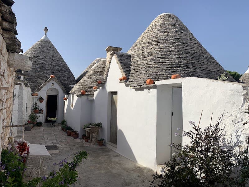 Traditional cone-roofed trulli houses in Alberobello, Italy, in the Puglia region