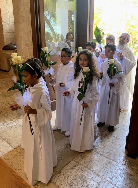 Children in First Holy Communion procession at Sant'Antonio church, Alberobello Italy