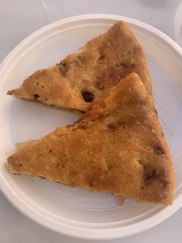 Food in Puglia: 23 Foods I Tried and Loved, From Cime di Rapa to Caffè Leccese Slices of golden-brown Puglian puccia flatbread on a white plate