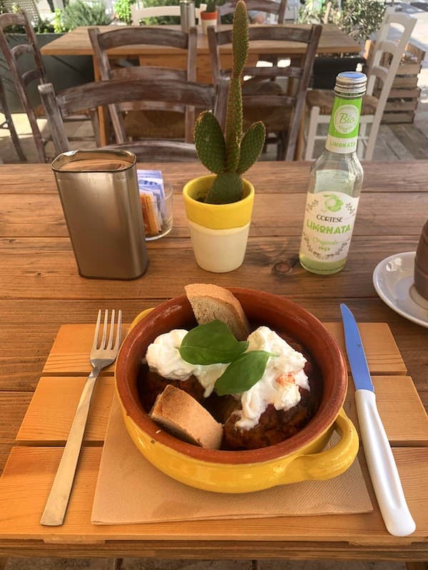 Food in Puglia: 23 Foods I Tried and Loved, From Cime di Rapa to Caffè Leccese Stuffed eggplant stew in a terracotta pignatta topped with stracciatella and basil - a traditonal Puglia dish