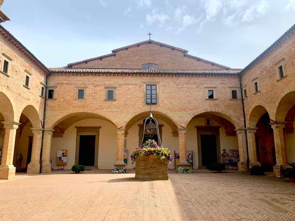 Basilica of Sant'Ubaldo on Mount Ingino above Gubbio, Italy, with its stone facade
