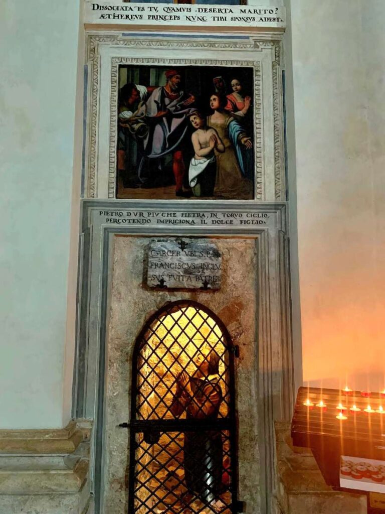 Small barred alcove, the traditional prison cell of St Francis, inside the Chiesa Nuova in Assisi, Italy