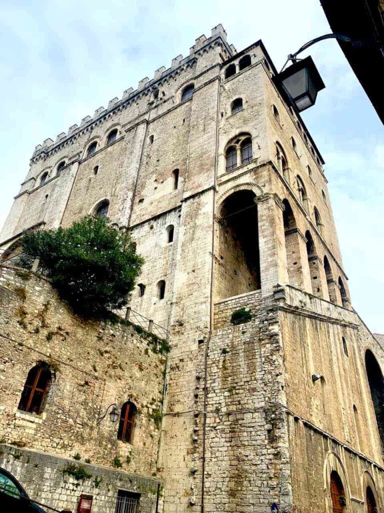 Historic Palazzo dei Consoli in Gubbio, Umbria, Italy, a medieval stone palace with a tall bell tower