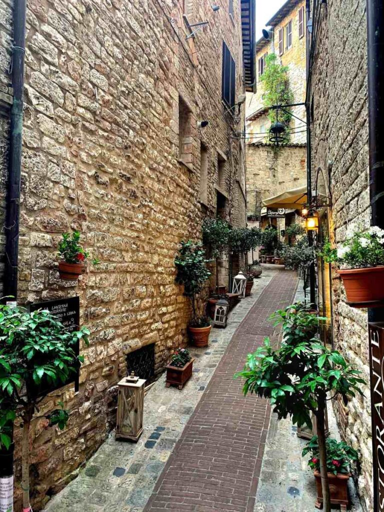 Medieval stone street in the historic center of Assisi, Umbria, Italy